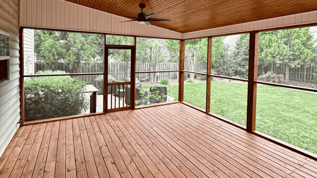 Beautiful custom-built screened deck with wooden flooring and ceiling in York County, SC, by Alexander Realty and Construction LLC.