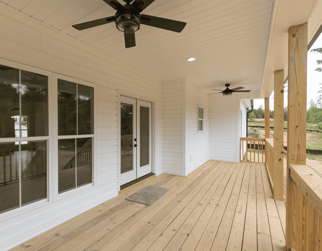 Spacious wooden deck with ceiling fans, perfect for outdoor living and entertaining in York County, SC.