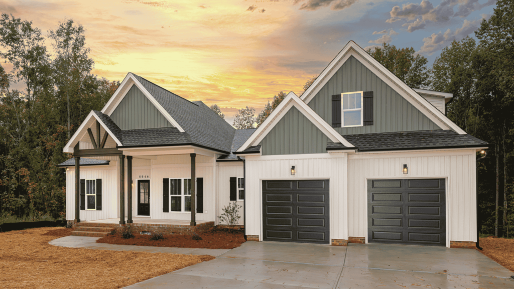 Stunning newly built modern farmhouse with a black roof and white siding, designed and constructed by Alexander Realty and Construction LLC.